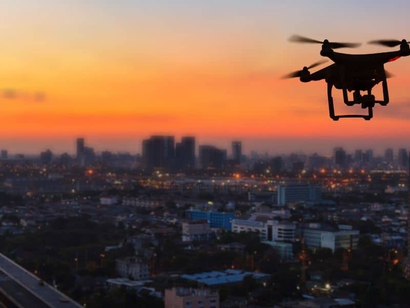 Drone performing LiDAR mapping to capture terrain information for rolling foothill properties.